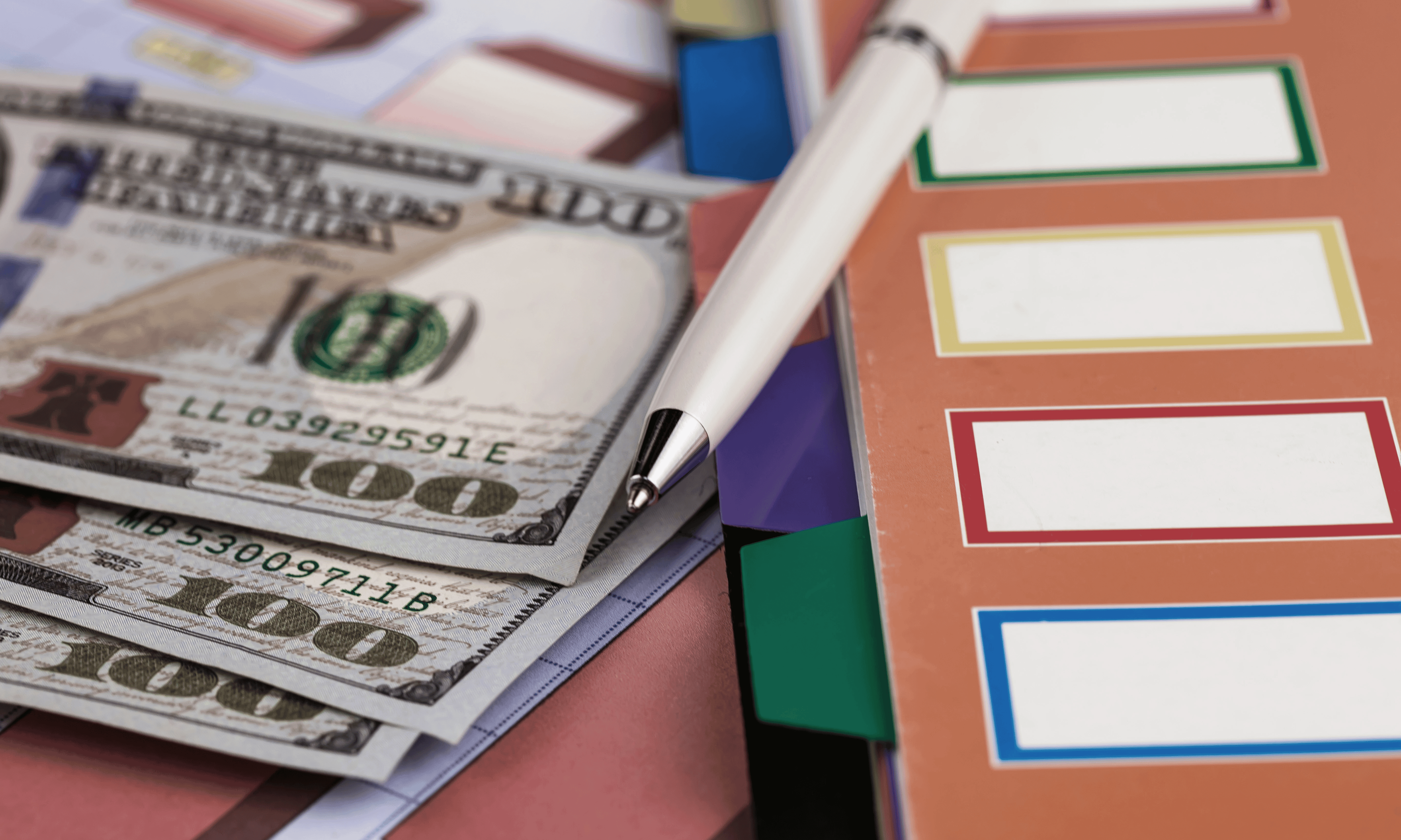 American Cash and cash envelopes and notebook with a pen