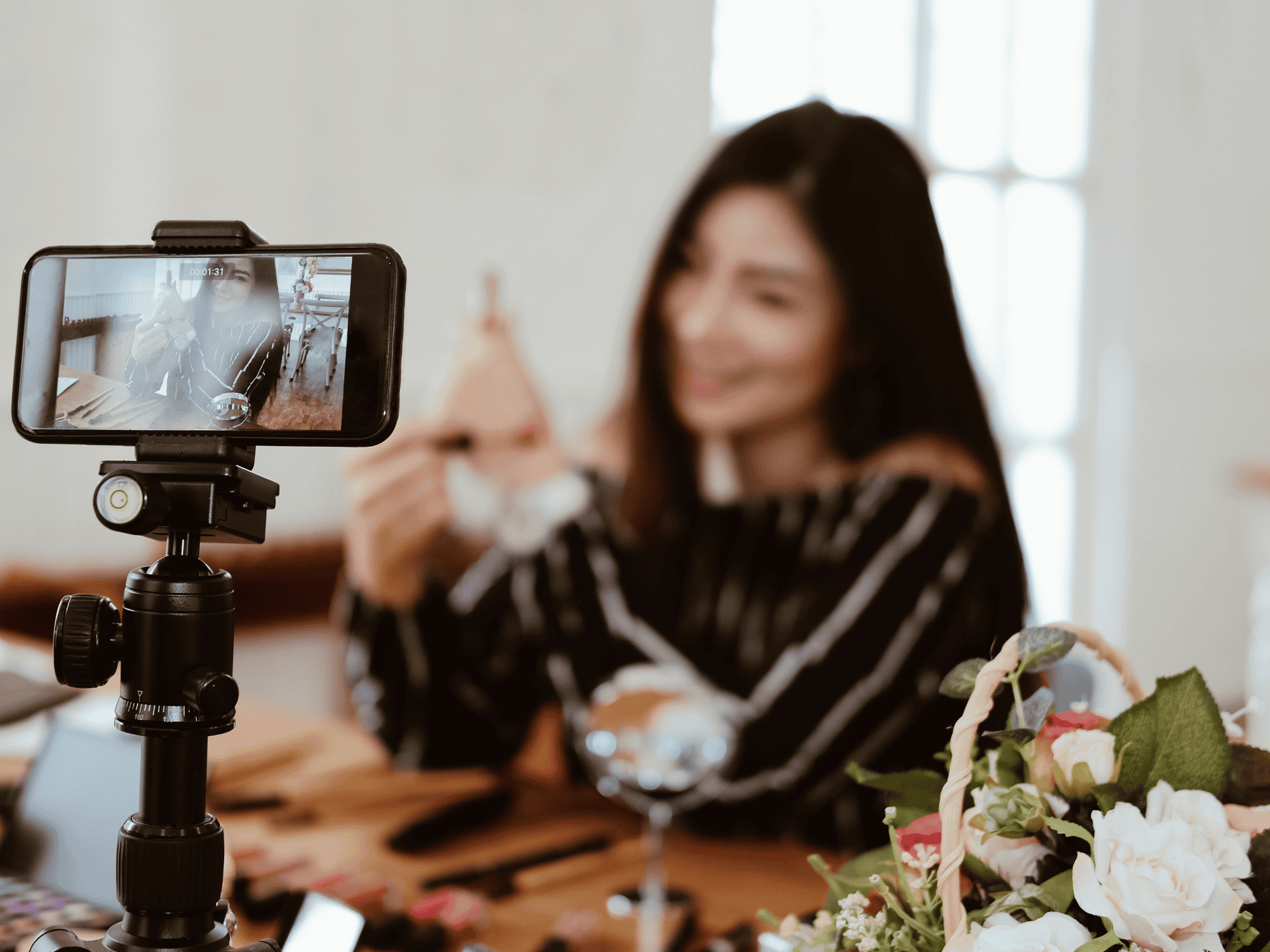 woman taping herself selling jewelry