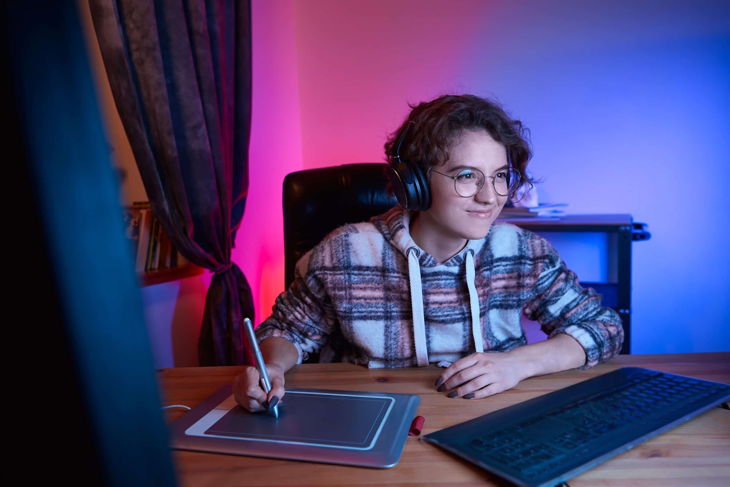 Digital desinger creating digital art using graphic tablet and stylus