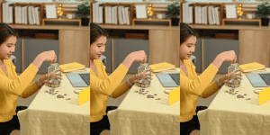 Teen Budgeting Tips - Teen saving money in a piggy bank sitting in living room