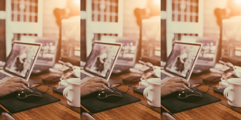 Woman working on computer and tablet