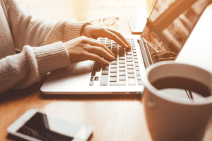 Woman using laptop on desk