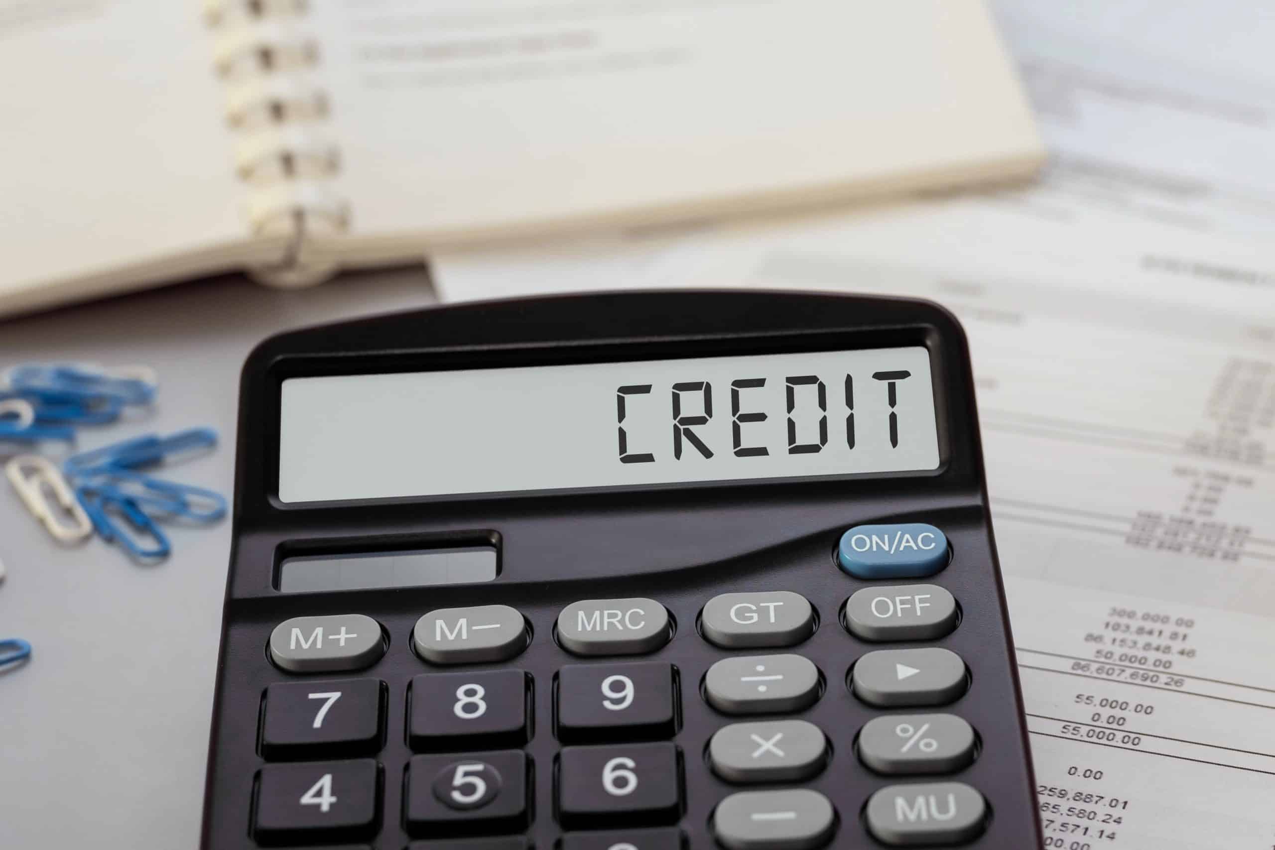 Black Calculator with the word Credit on display - Teaching teens about credit