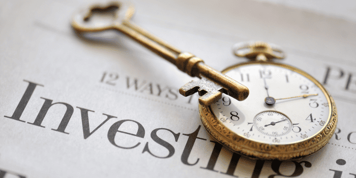 Newspaper with a vintage clock on Teen Investing Basics