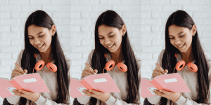 Teenage girl writing in her pink notebook - Money Tracker Notebooks for Teens