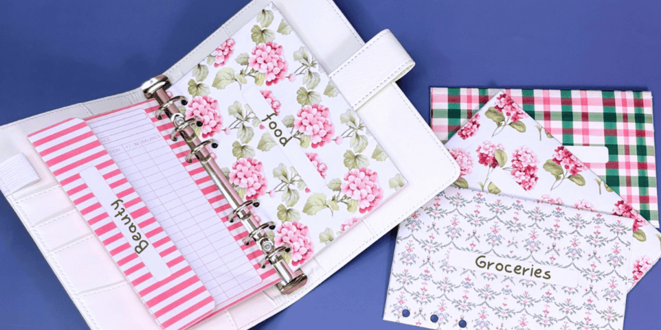 Pink flowers with binder laying out - Cash envelope Systems for teenagers