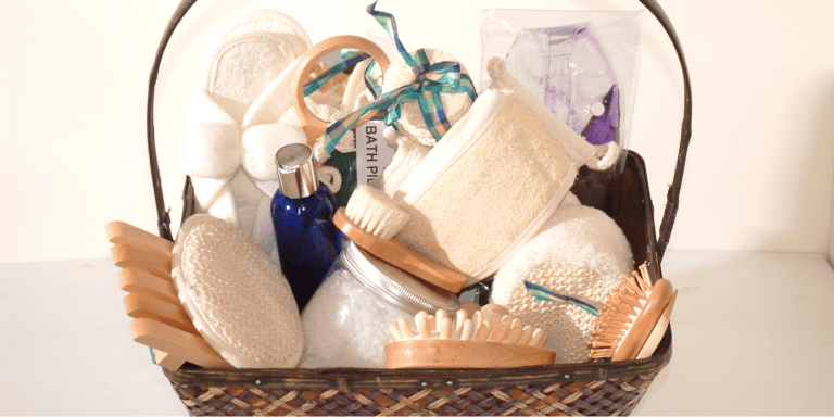 A gift basket on a vanity with self care items - Teen Girls Gift Basket
